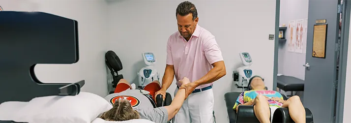 Chiropractor Chandler AZ Dan Grant with patients Chiropractor Chandler AZ Dan Grant with patients
