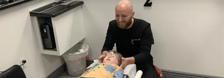 Chiropractor Chandler AZ Ryan Ambacher Adjusting Child